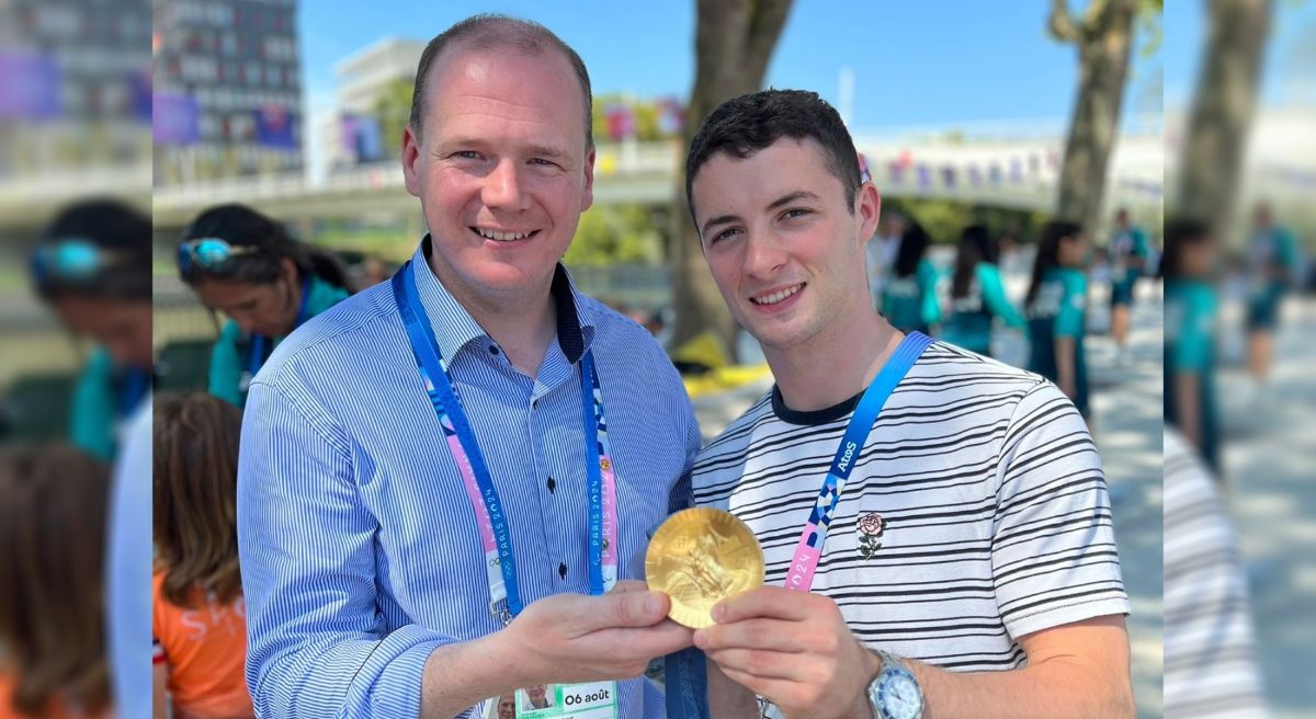 Minister Gordon Lyons and Olympian Rhys McClenaghan